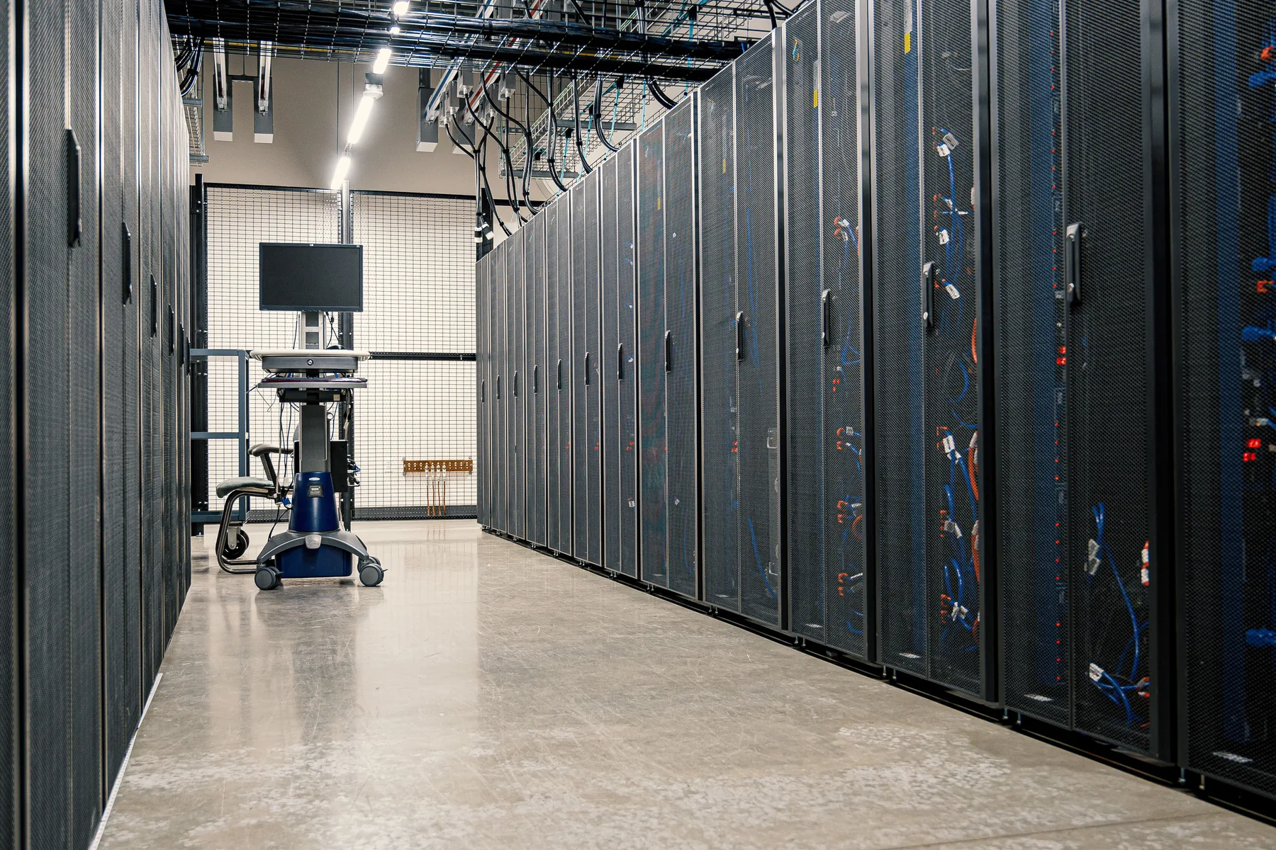 Modern enterprise data center with rows of server racks
